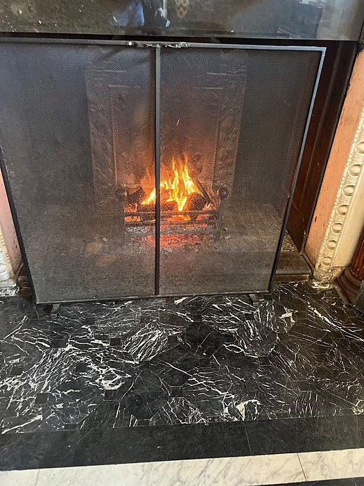 Really cozy log fire burning at The Oratory's reception