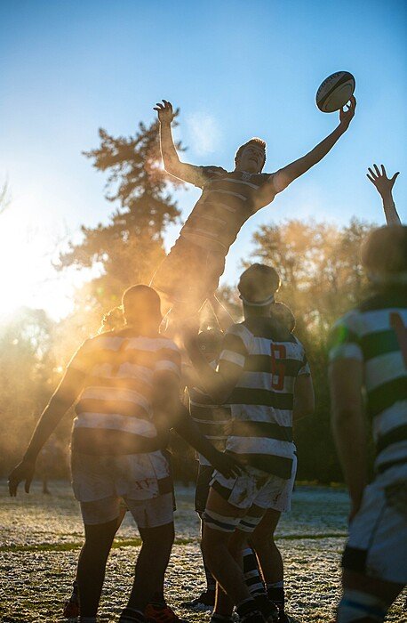 Players of the Canford School boys Rugby team performing a line out lift