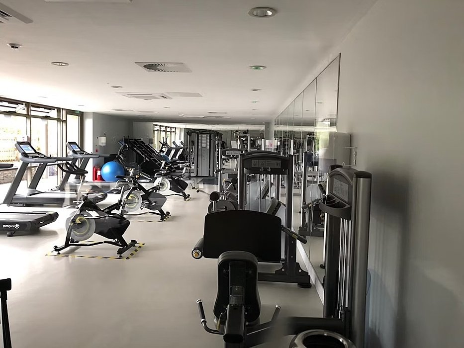 a Gym with treadmills, exercise bike and other cardio equipment