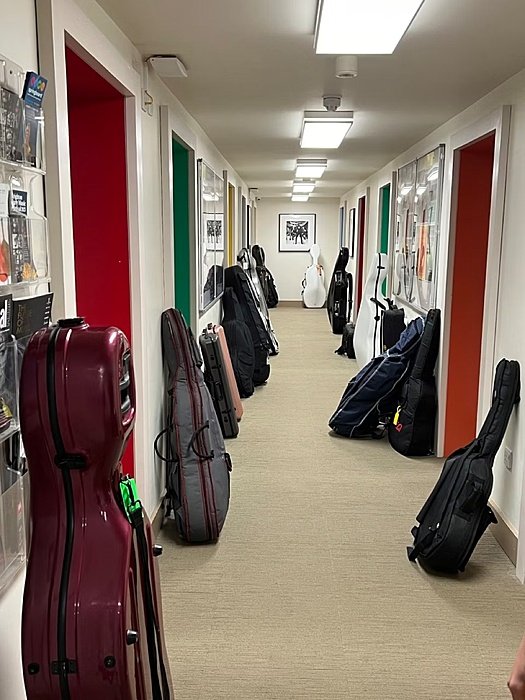 waiting instrument bags outside the many classrooms at Brighton's Music School