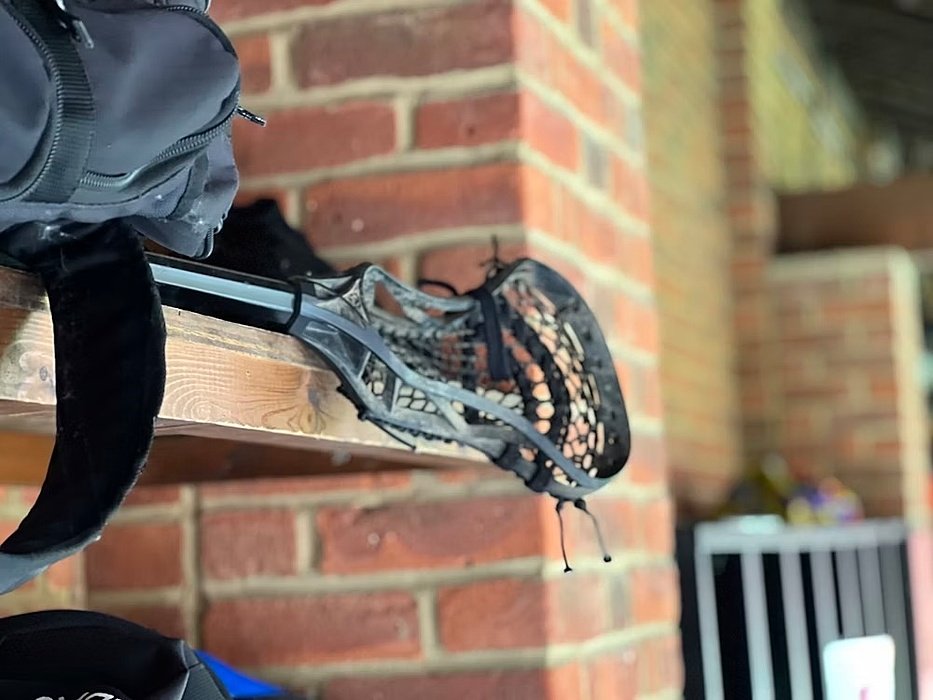 lacrosse racket on a shelf