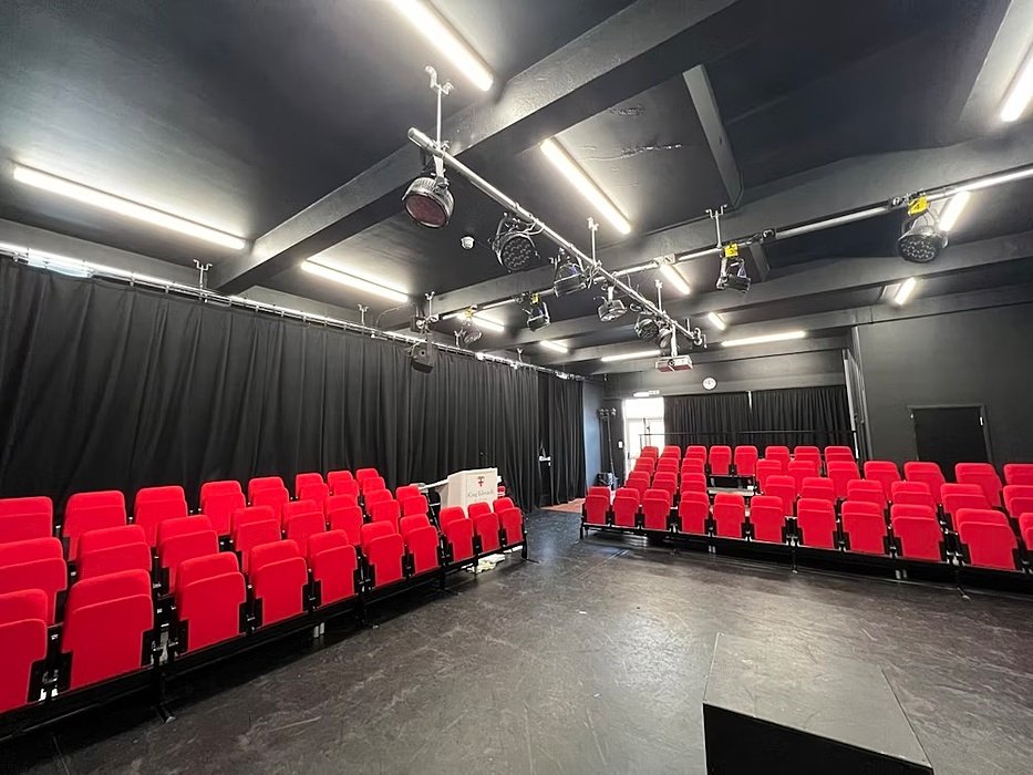 The red rows of seats at the modern Theatre at KESW