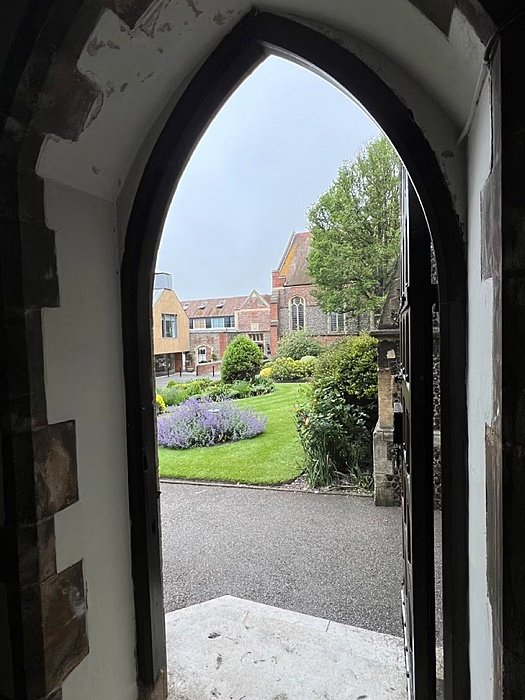 View through a door on the school campus at Brighton College