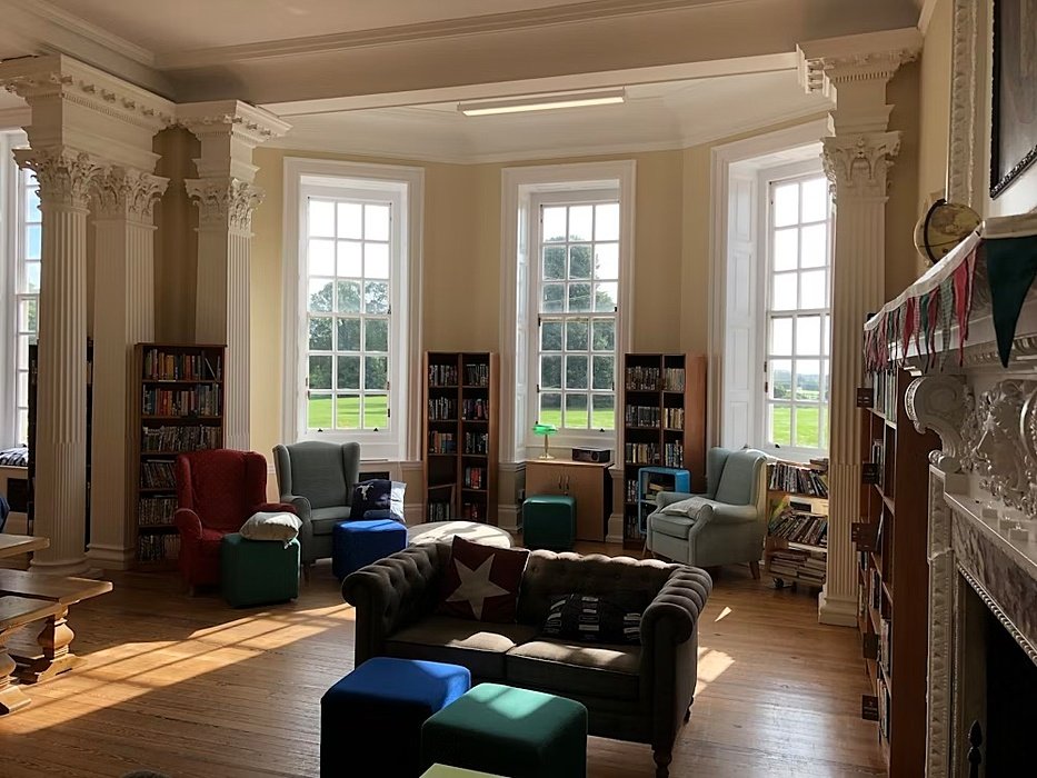 a school library with comfortable sofas