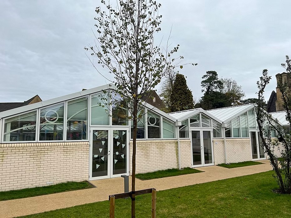 classrooms with glas and young tree infront of it