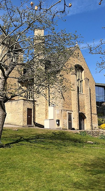 The Chapel at Monkton Combe School in spring, surrounded by the green campus