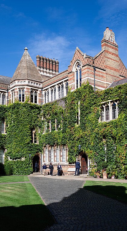 Rugby School Quad during summer with the surrounding school buildings covered in ivy