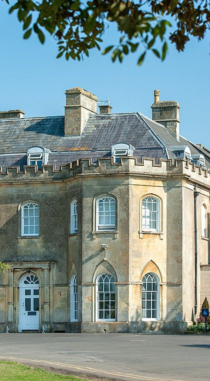 the beautiful Stonar School in white limestone from the front