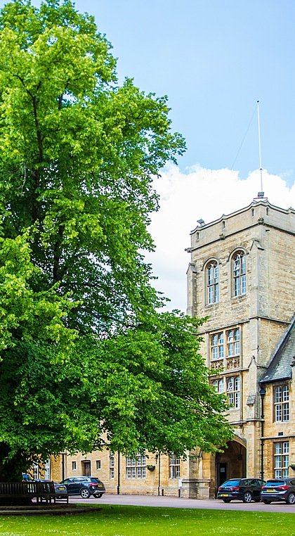 The Uppingham School from the front with its main entrance and big old tree in front