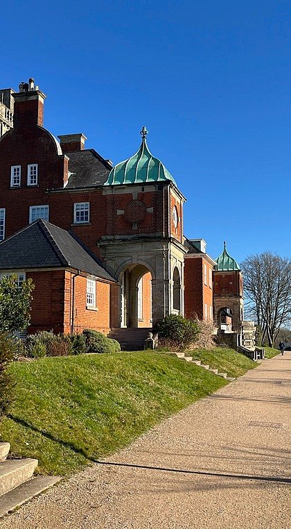 Historic brick building with steps and entrance at Pangbourne College