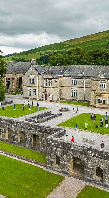 areal view of the school campus at Sedbergh School with rolling hills in the background