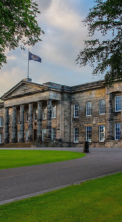 Playfair Building, the historic main building with columns at British boarding school
