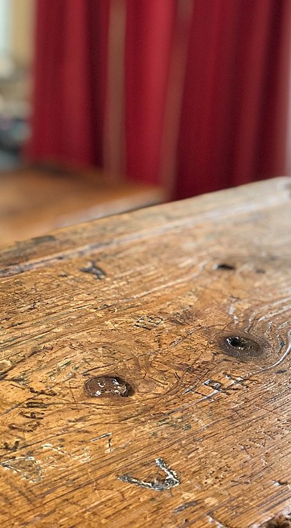 Wooden school bench with engravings