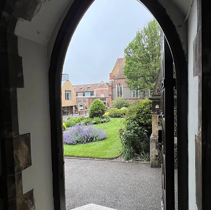 View through a door on the school campus at Brighton College
