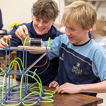 Students engaged in hands-on engineering activities at Wells Cathedral School.