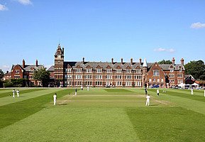 Cricket players infront of main school building