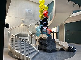 Modern staircase with art installation at English boarding school