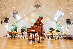 an open piano in a music classroom at Frensham Heights School