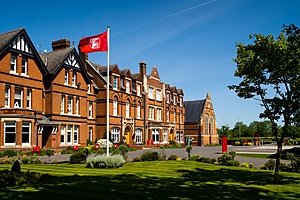 Kent College's red bricked main school building from the front