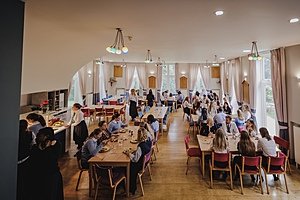 the cosy dining hall of a bearding school busy with students