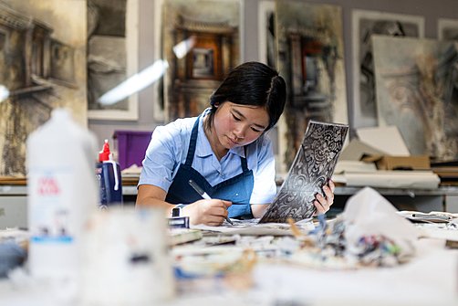 Girl immersed in a creative activity at Cheltenham Ladies College