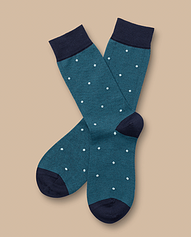 Green socks with white dots