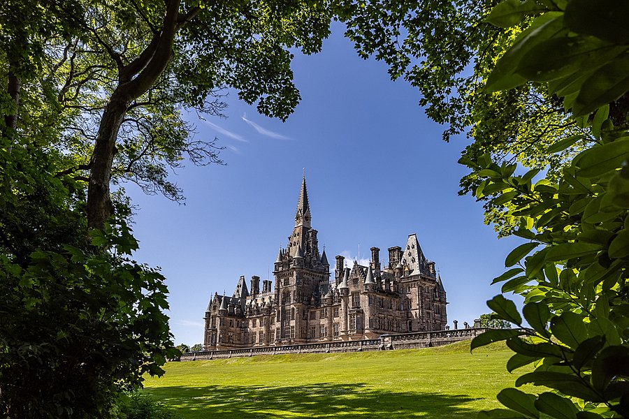 View onto Fettes College framed by green trees