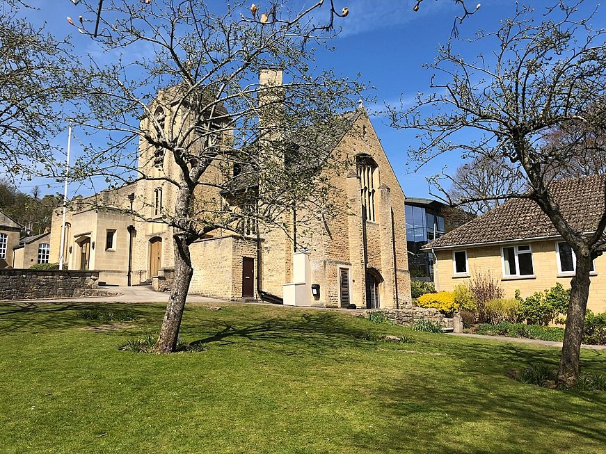 The Chapel at Monkton Combe School in spring, surrounded by the green campus