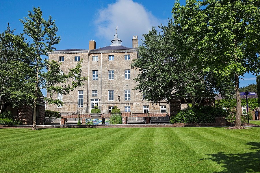 The main building of Sevenoaks School surrounded by its green campus