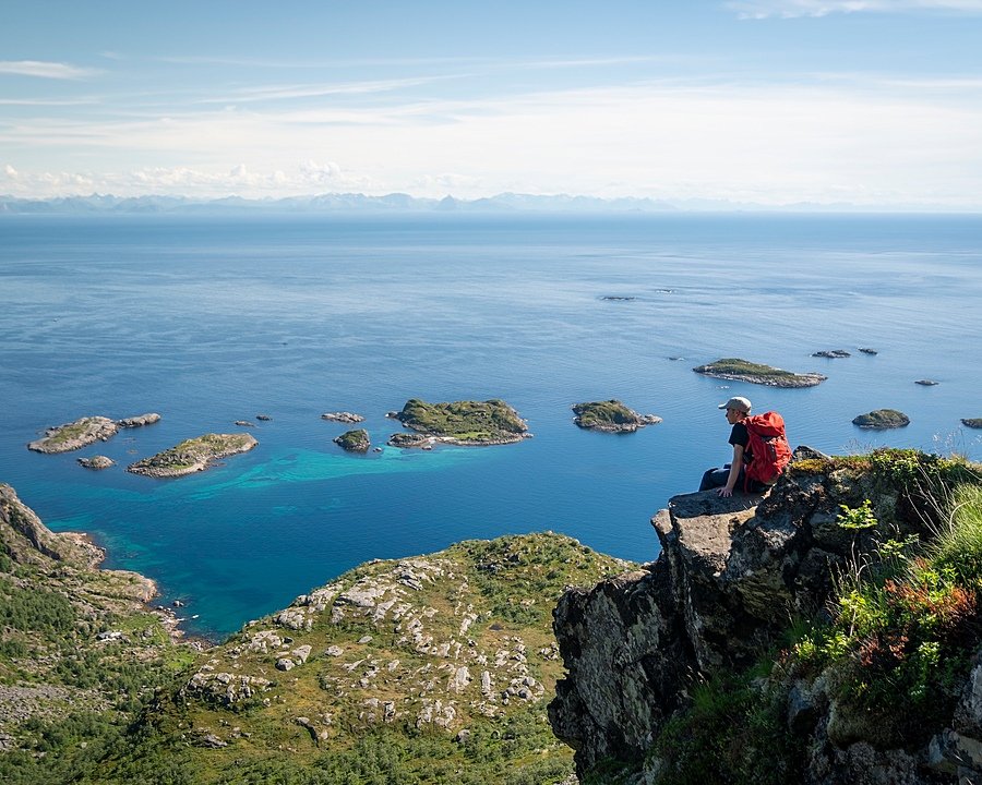 A Gordonstoun pupil sitting on a cliff overlooking a gorgeous Scottish bay