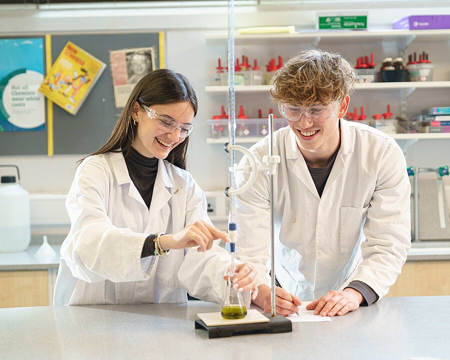 Students doing an experiment during a science lesson at St Clare's Oxford Summer School t