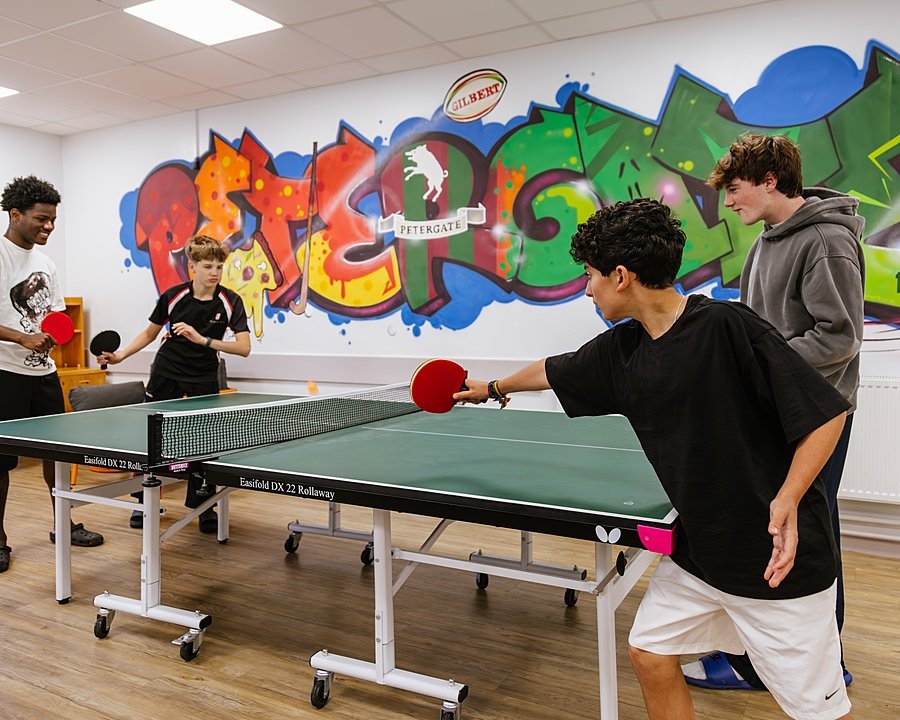 Students playing a round of table tennis at Blundell's School