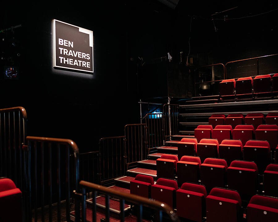 the red rows of seats in the school's own Theatre at Charterhouse