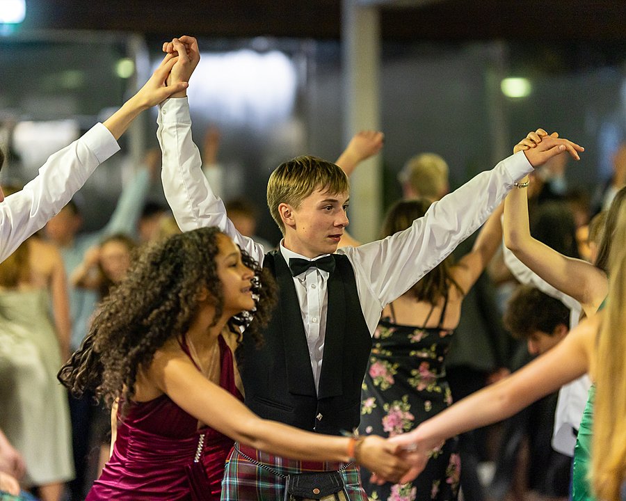 students at Fettes College performing traditional ceilidh dancing and having fun