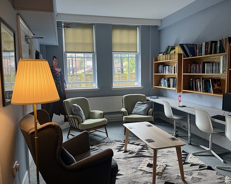 A cosy communal space with chairs and desks in one of the boarding houses
