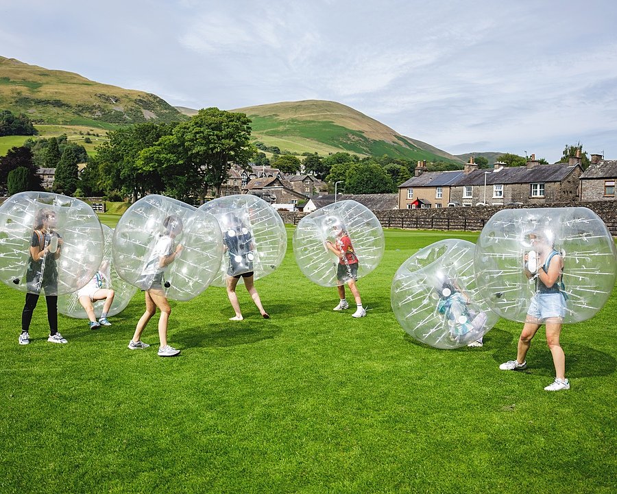 Students of the Sedbergh International Summer School doing Zorbing outside