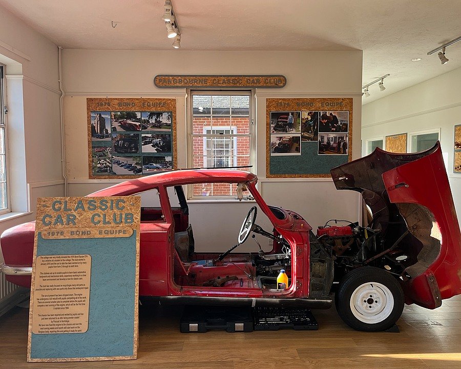 Partially built car displayed in a design technology workshop