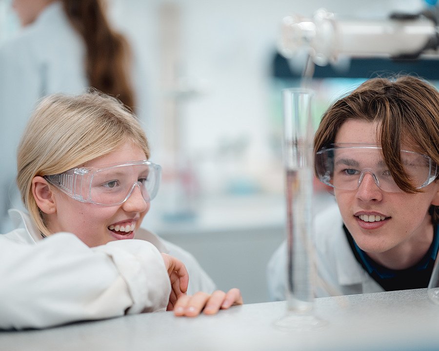 Students wearing safety goggles during a science lesson at Pangbourne College