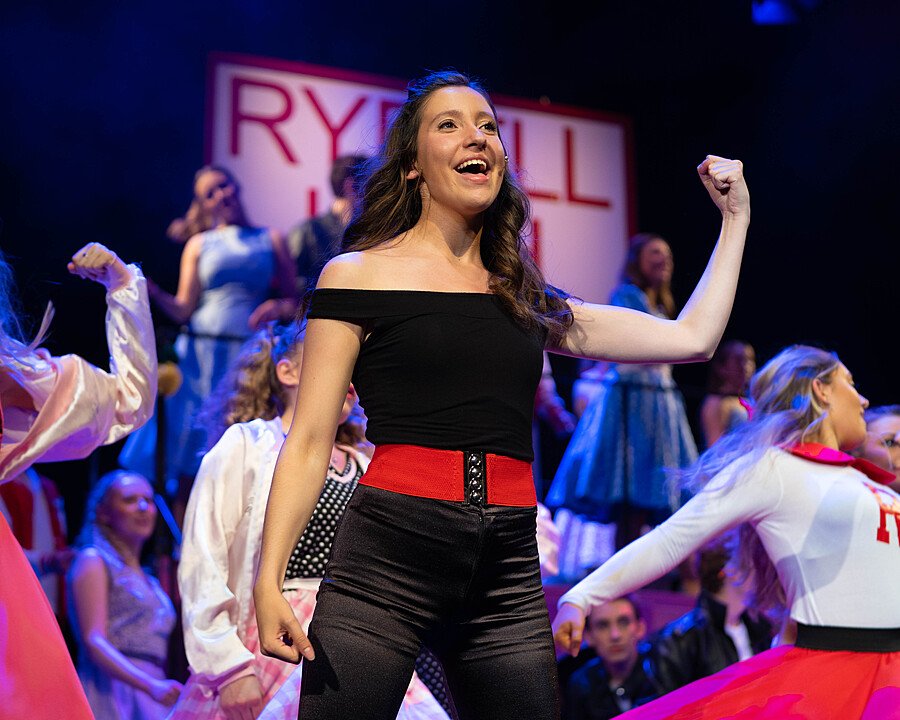 Grease the Musical - School theatre performance with lead actress on stage