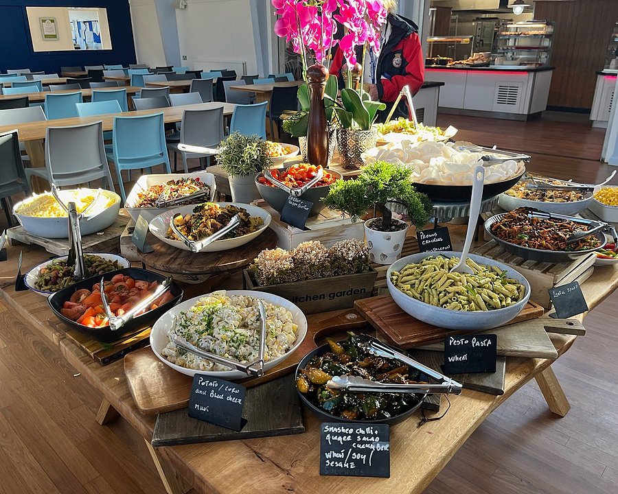 Selection of dishes displayed on a buffet table in the dining hall