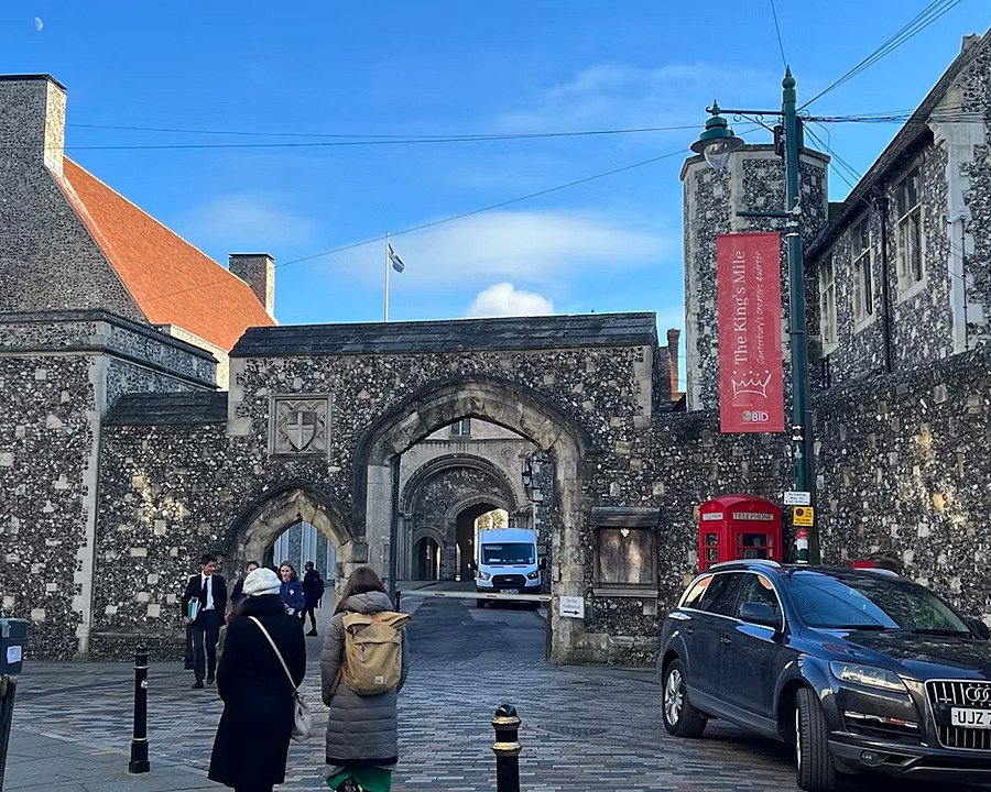 One of the entrances to the school campus with stone archways and stunning buildings