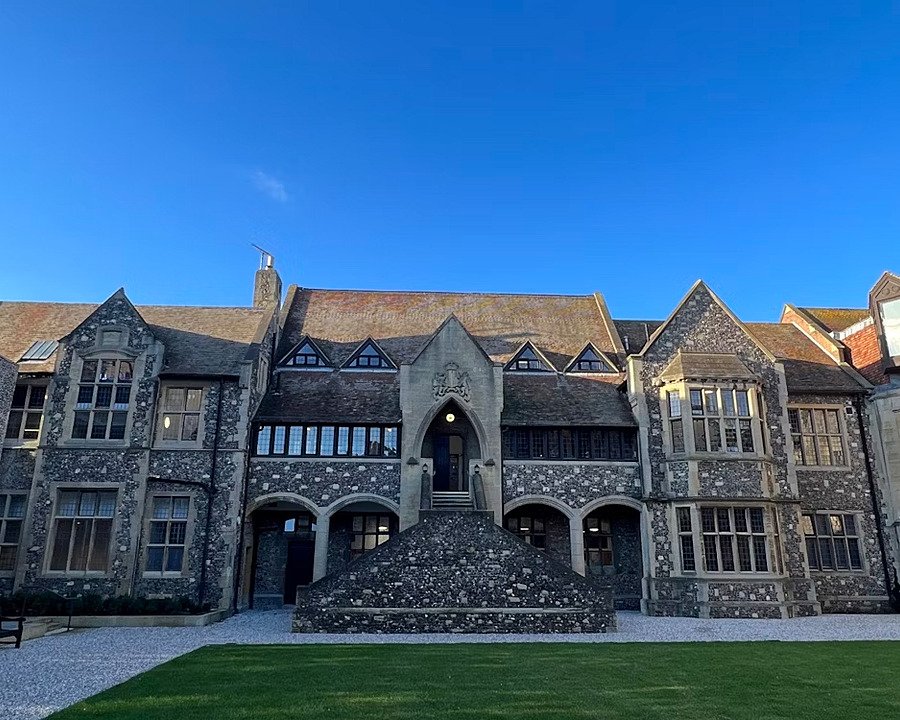a stunning stone staircase outside leading up to the beautiful old school building