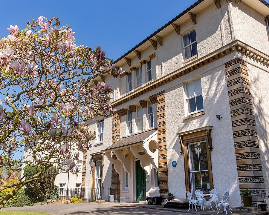 Malvern College Boarding House Number Nine from the outside in spring blossom