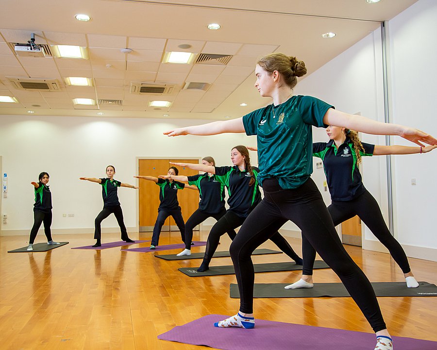 female students doing a Yoga class at Malvern College