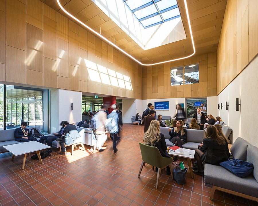 Bright modern common area at Haberdashers’ Monmouth School with pupils