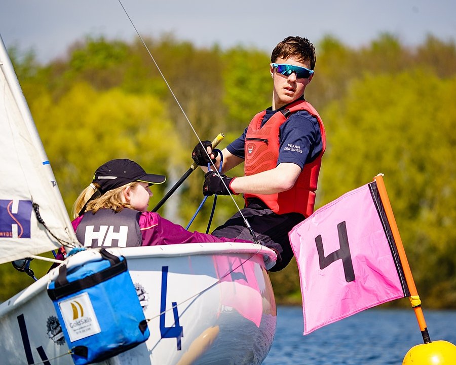 two sailing students in a boat at Rutland Water, racing