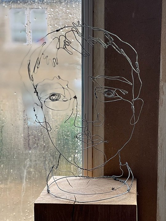 Art exhibit of a metal wire portrait at the art department of Westonbirt School