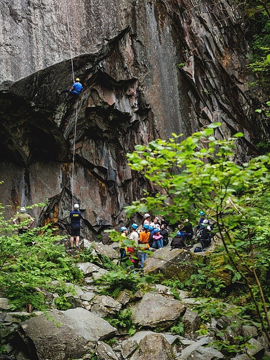 Students climbing on a steep face during Sedbergh International Summer School