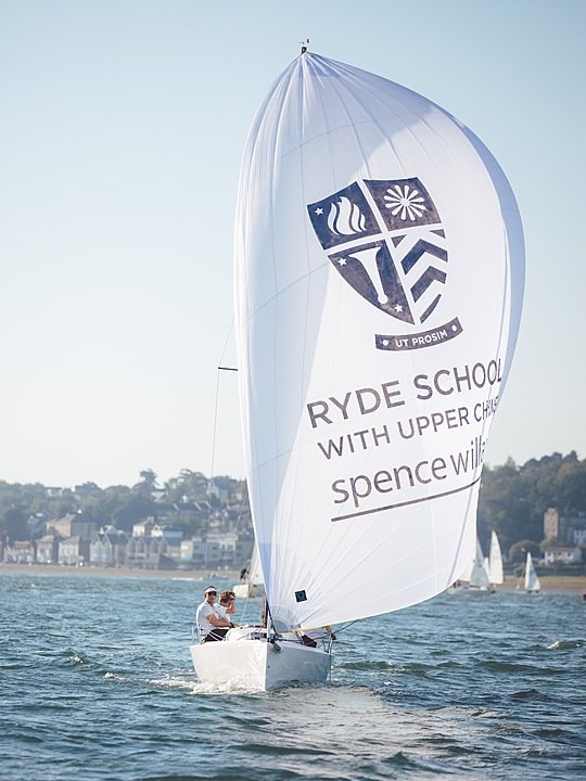 one of the schools sailing boats with students during their sailing lessons
