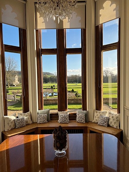 A bay window bench with a view of the beautiful campus outside Clayesmore School